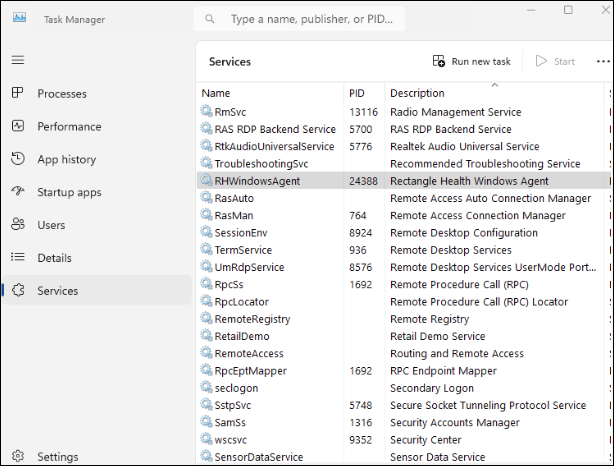 The Task Manager window. RHWindowsAgent is highlighted in gray from the Services list.